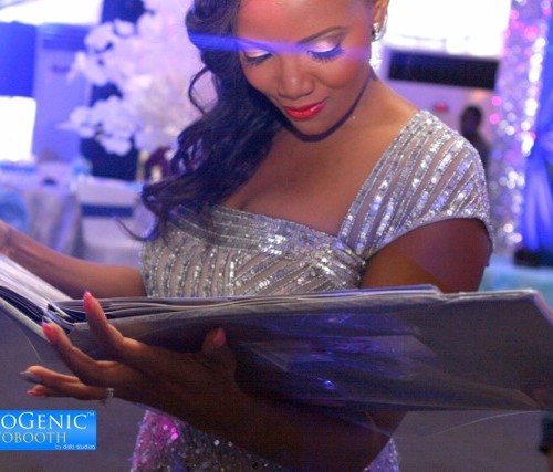 bride loving her photobooth guest book album
